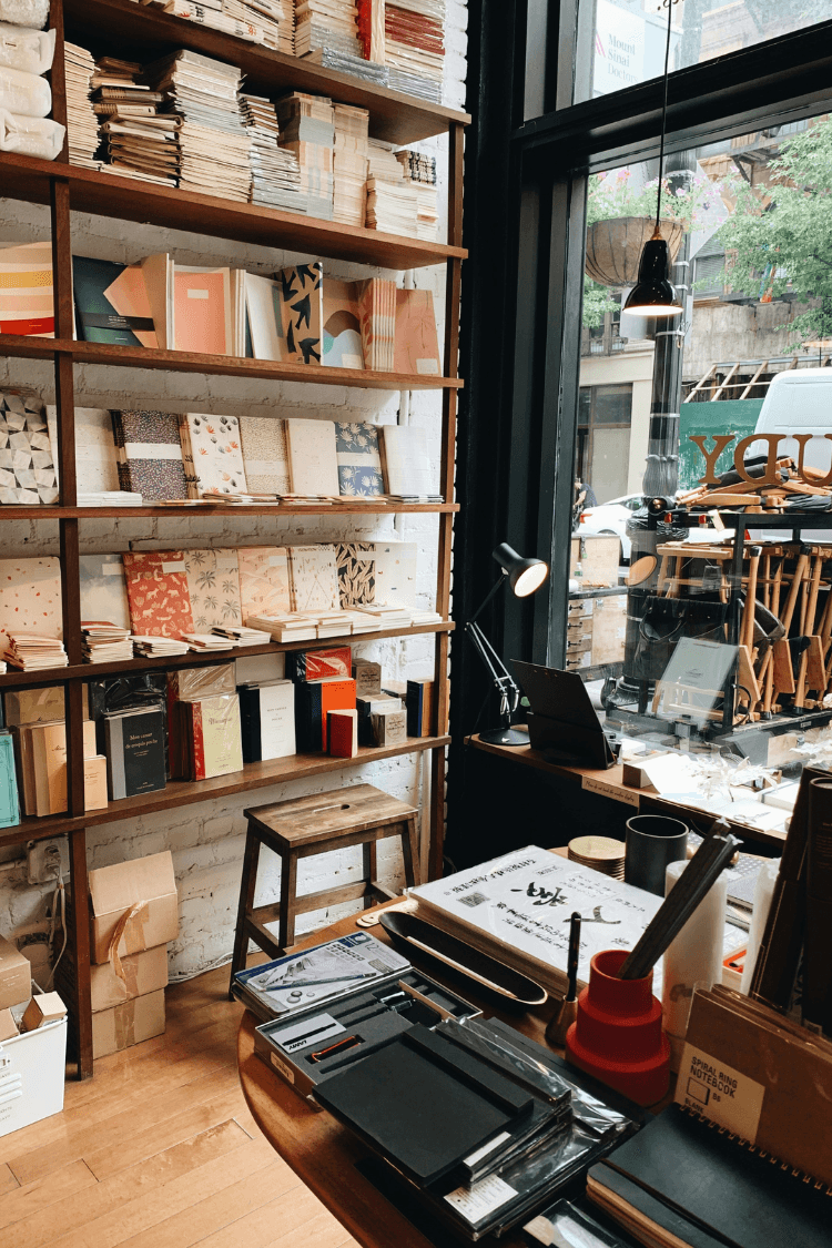 Inside a stationery shop with notebooks on shelves