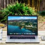 Open laptop on table in the garden