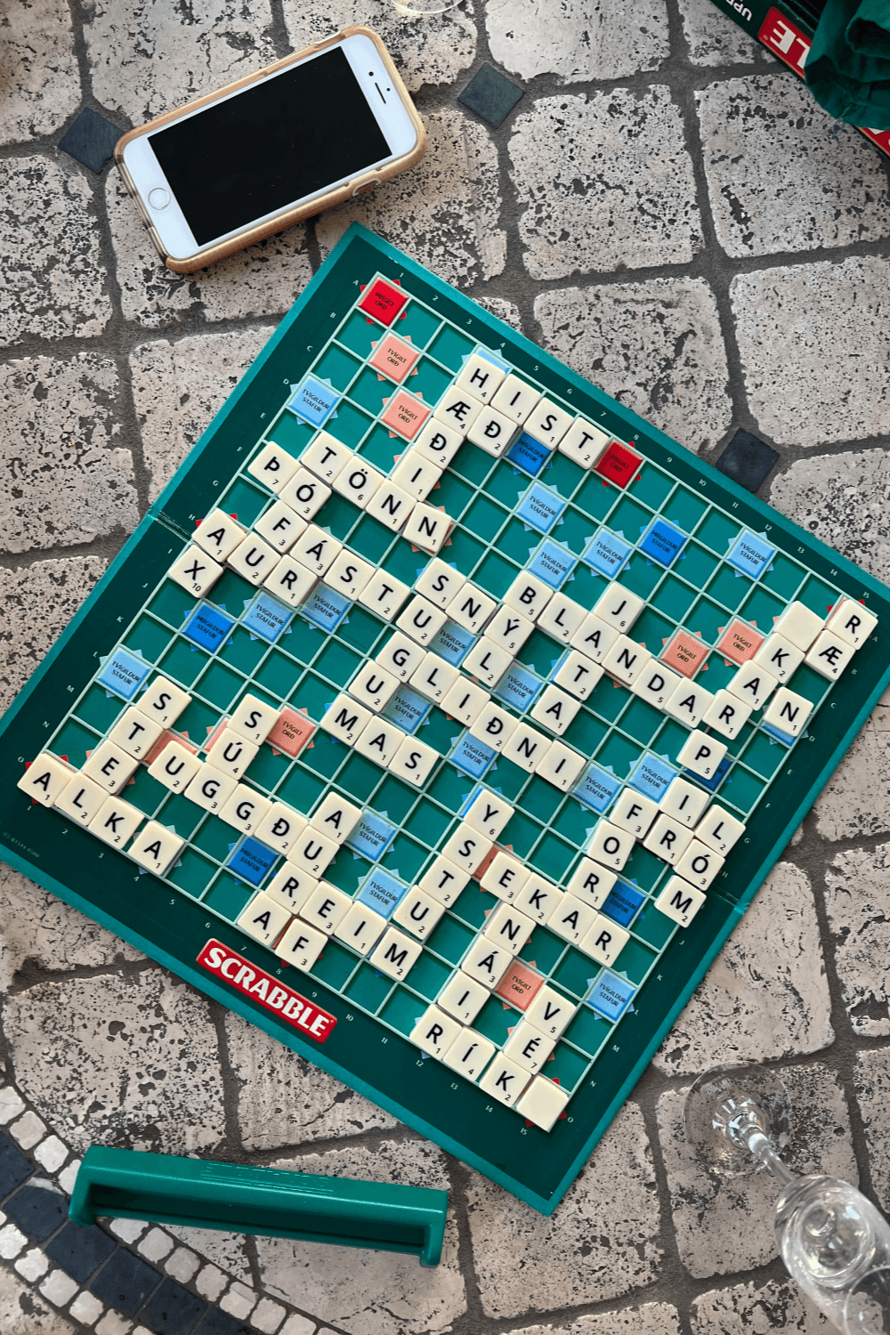 Scrabble board on pavement set up to play