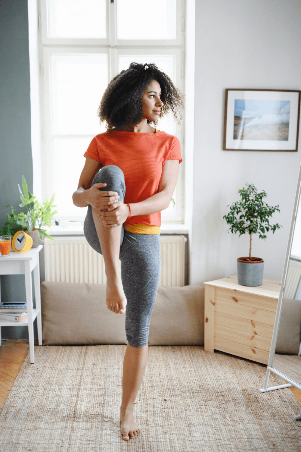 Woman doing stretching exercise at home