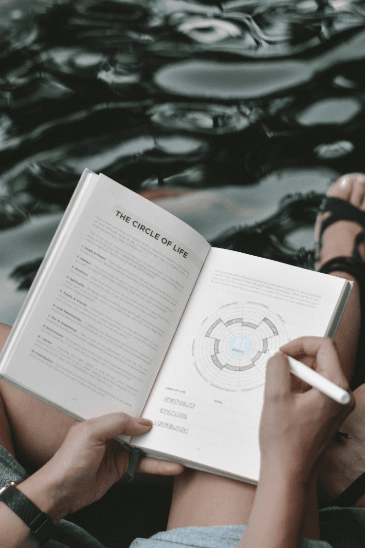 Woman filling in journal