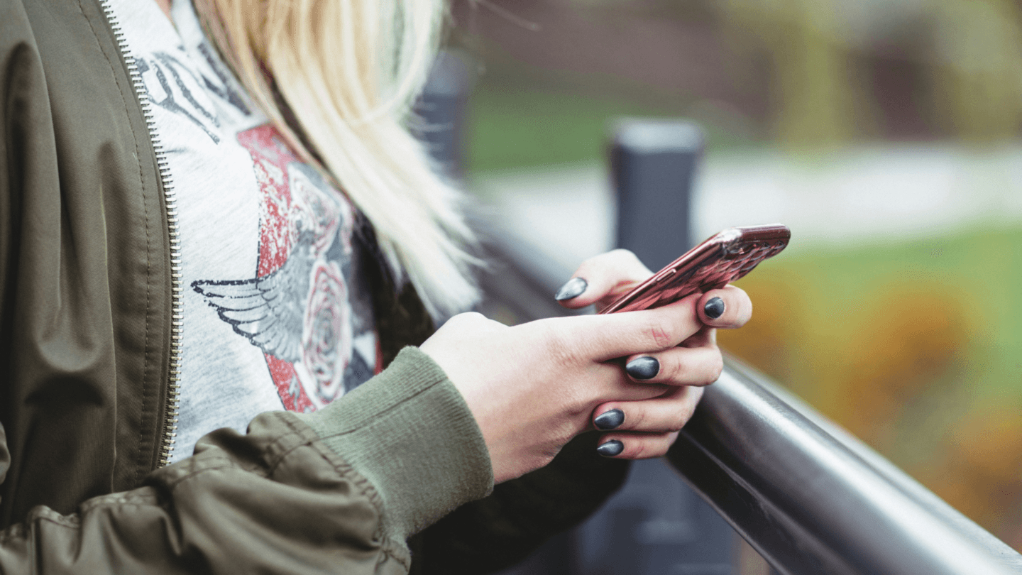 Woman looking down at her phone