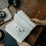 Woman looking at a note book used for journaling
