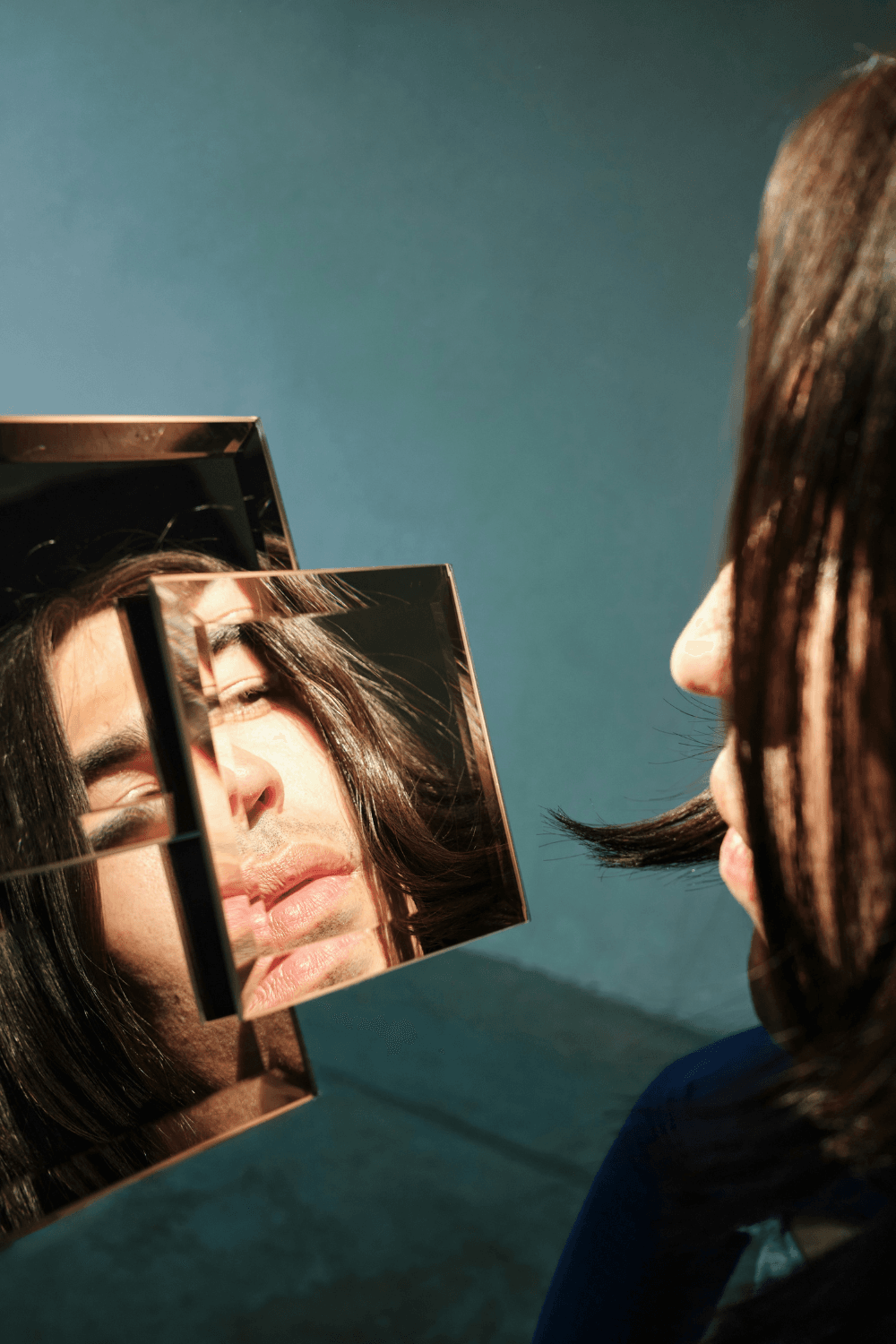 Woman looking in a mirror scrutinising her appearance