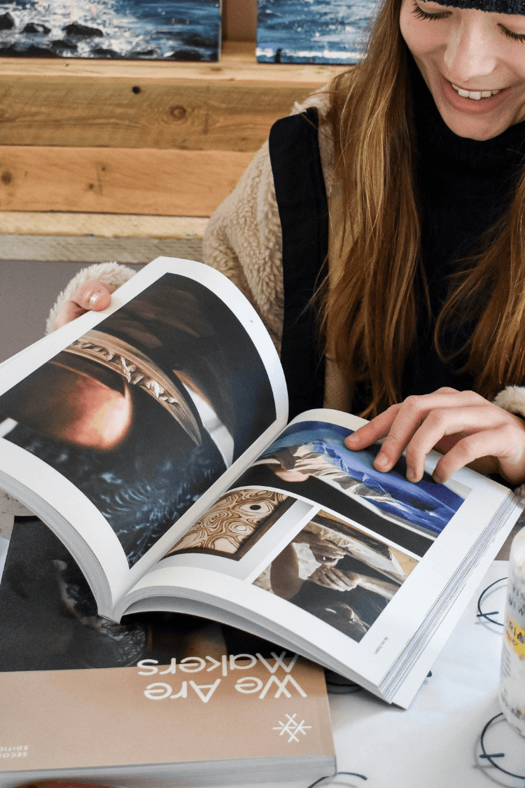Woman reading We Are Makers magazine