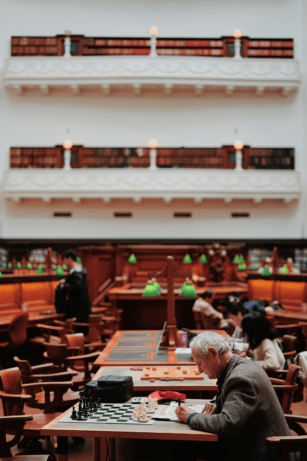 older man preparing for a chess game