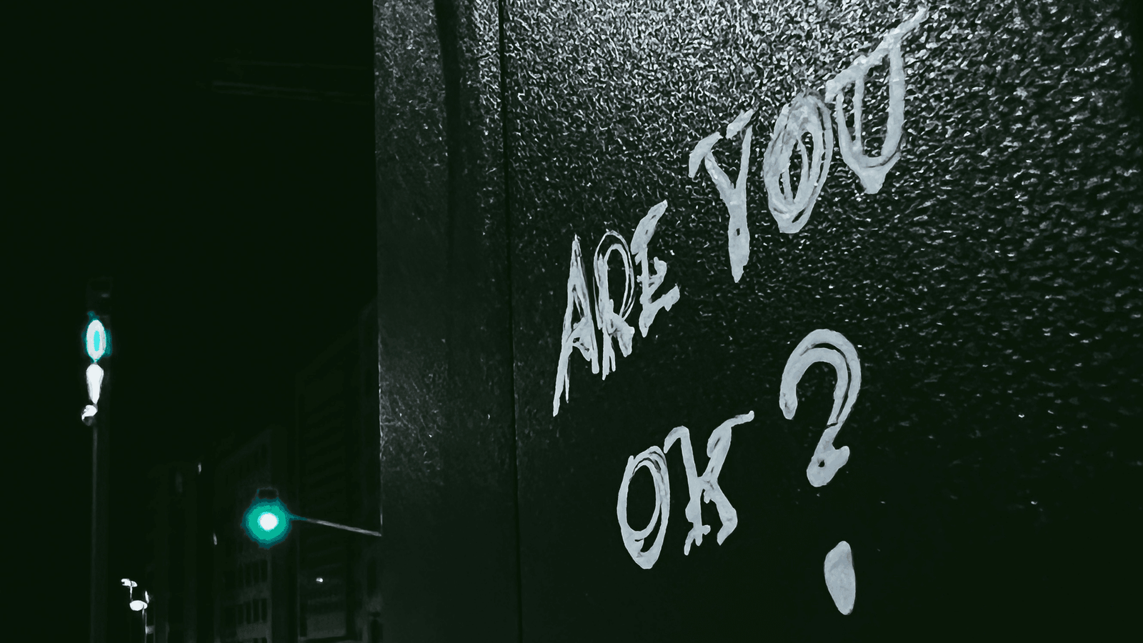 Are you ok written on wall in white paint