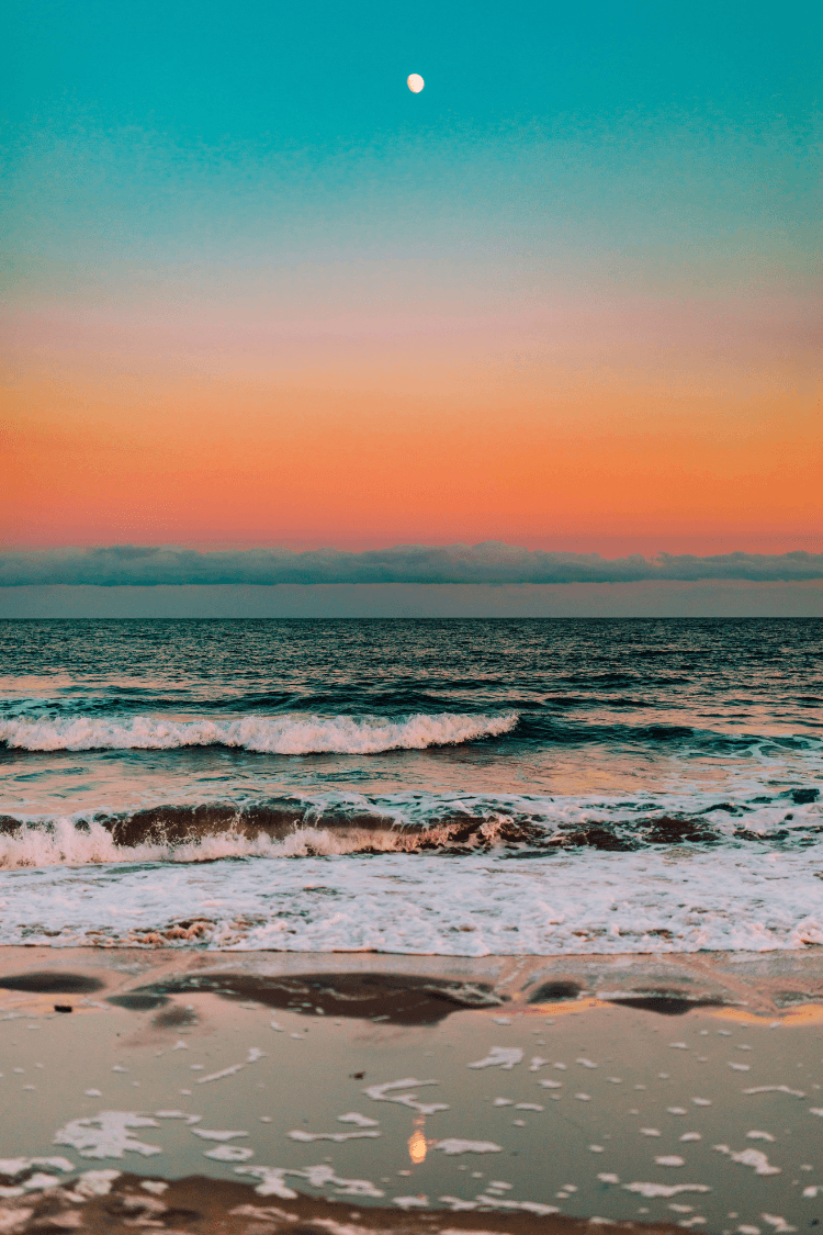 Beautiful orange sunset over the ocean with a hint of blue sky remaining