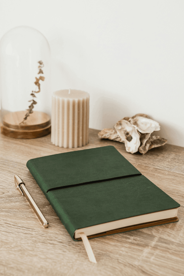 Dark green notebook on desk