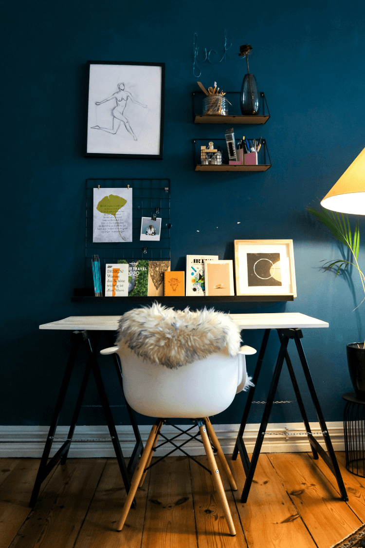 Home office with colourful pictures on wall