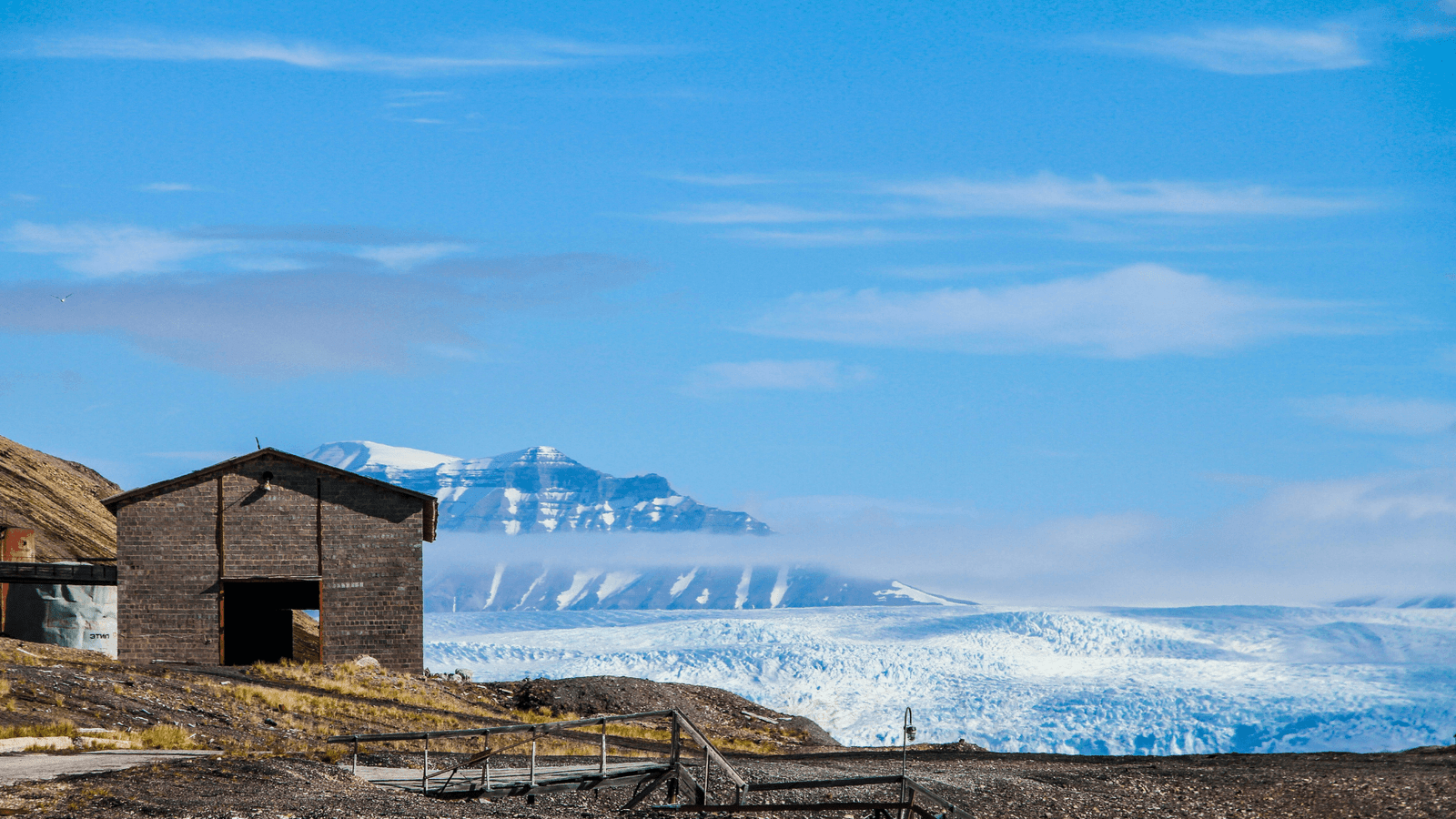 House in front of a Glacier Pyramiden Svalbard
