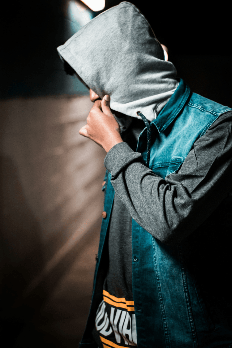 Man hiding his face with his hood