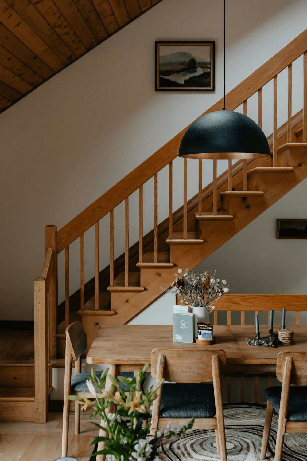 Neat and tidy wooden stairs and table with plant