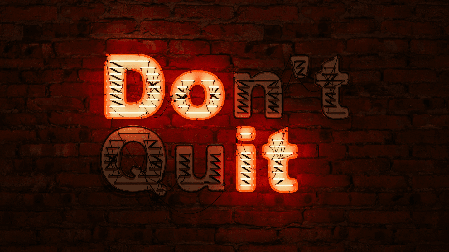 Neon sign saying don't quit
