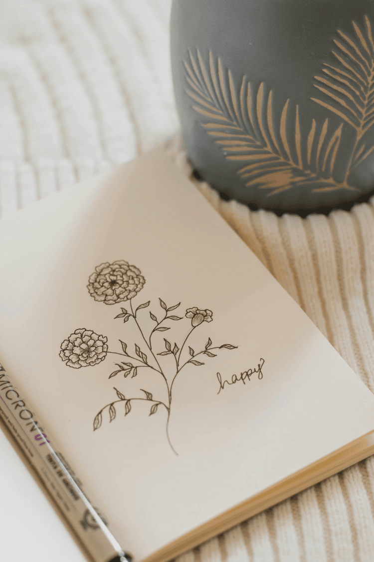 Notebook with the drawing of a flower on