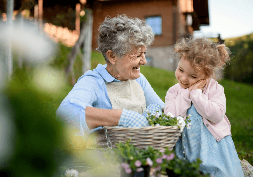 Older woman outdoors with granddaughter