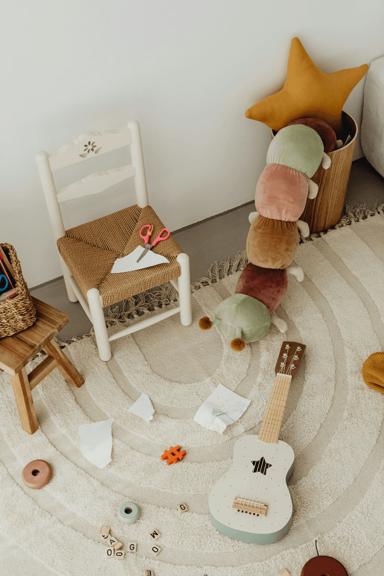 Paper and toys on the nursery floor