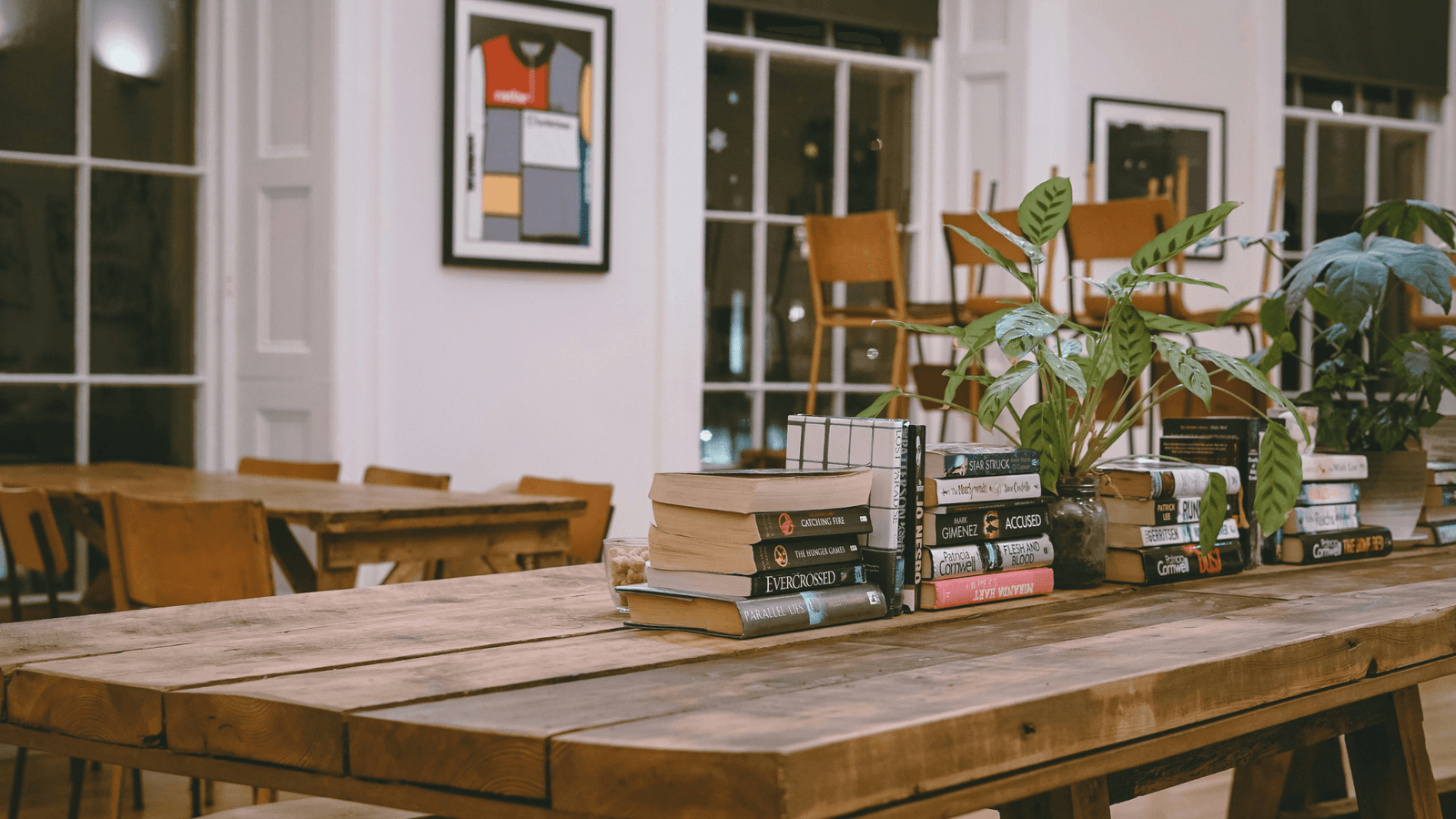 Selection of books on long wooden table