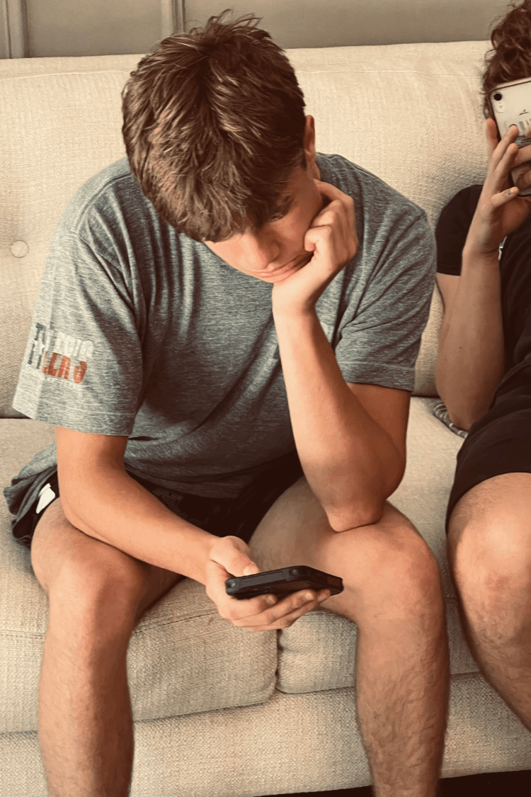 Teenage boy looking at phone