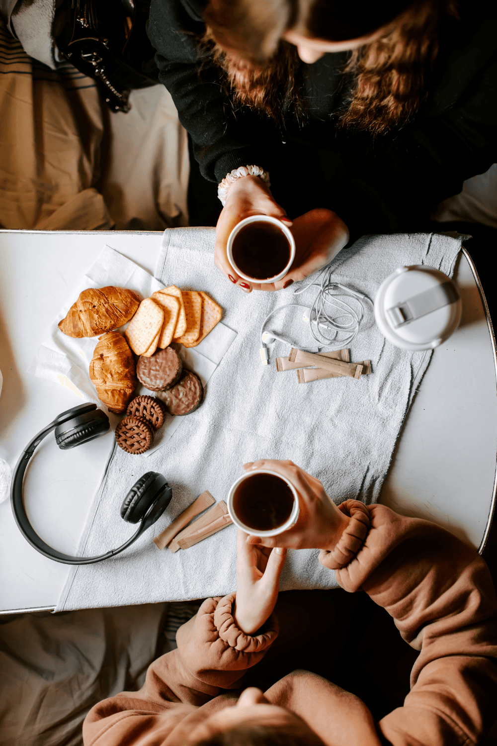 Two friends drinking coffee together