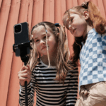 Two girls looking at a phone