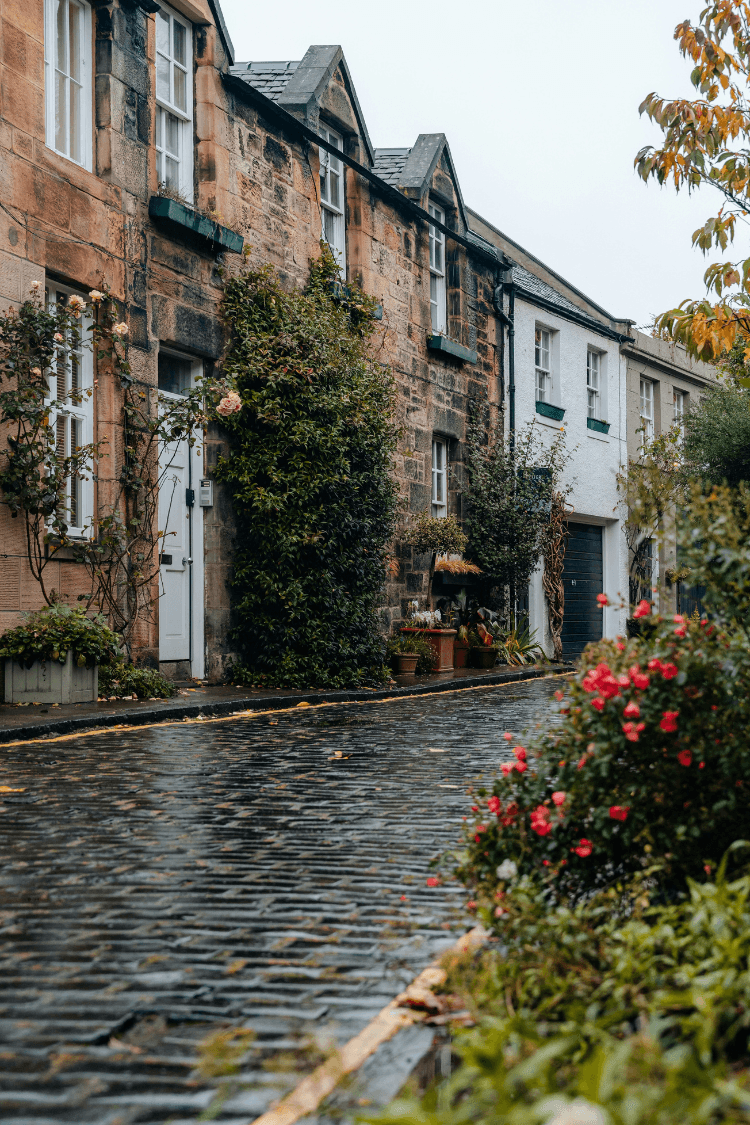 Wet cobblestone street after rainfall in Edinburgh, UK