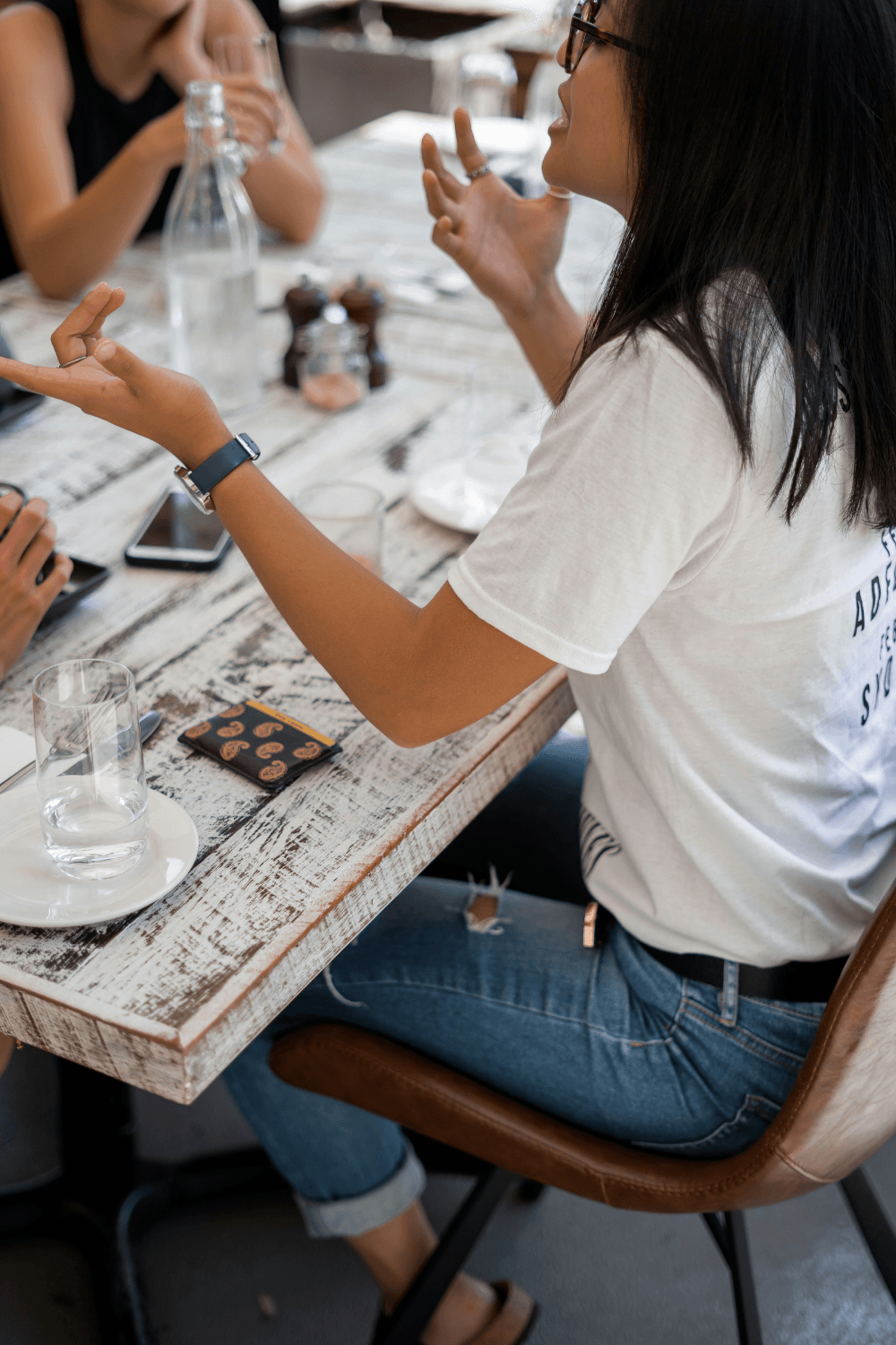 Woman sitting at a table arguing