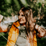 Woman taking a selfie in the park
