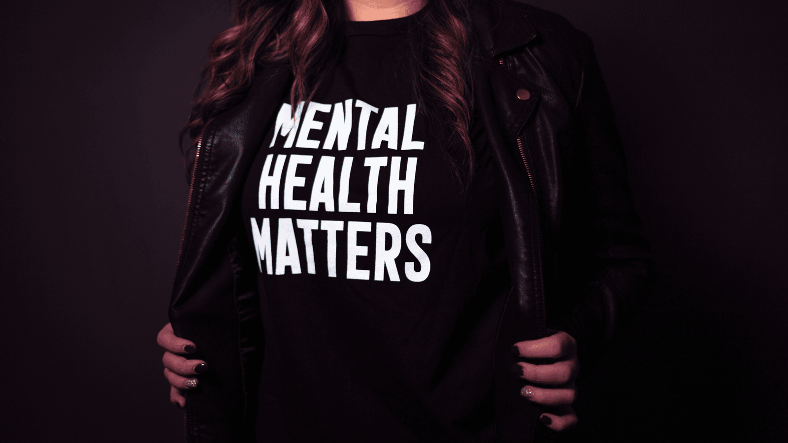 Woman wearing a t-shirt with mental health matters printed on it