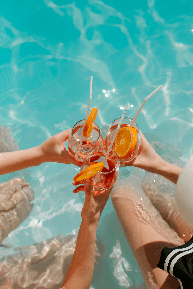 Women having drinks in the pool on holiday
