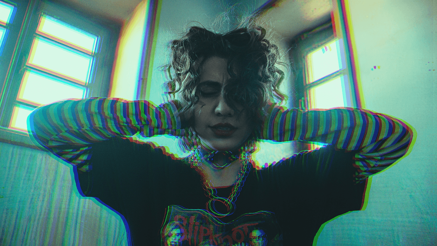 Young woman covering her ears as if in pain