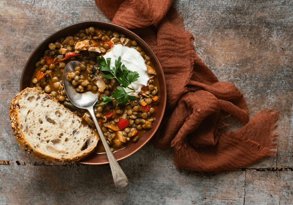 bowl of lentil soup and slice of wholemeal bread