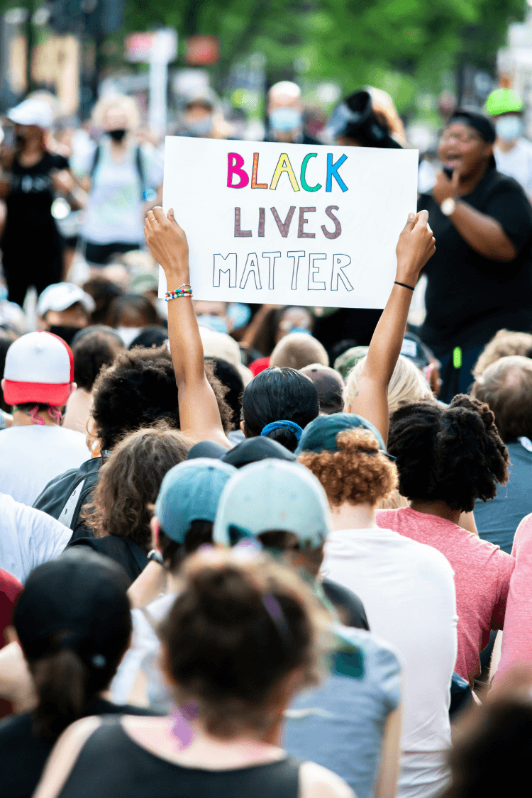 Black lives movement - man holding banner - a time of change