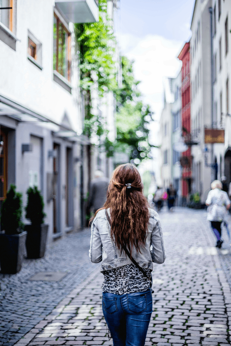 Woman walking through pedestrianised area