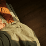 Young woman asleep in bed