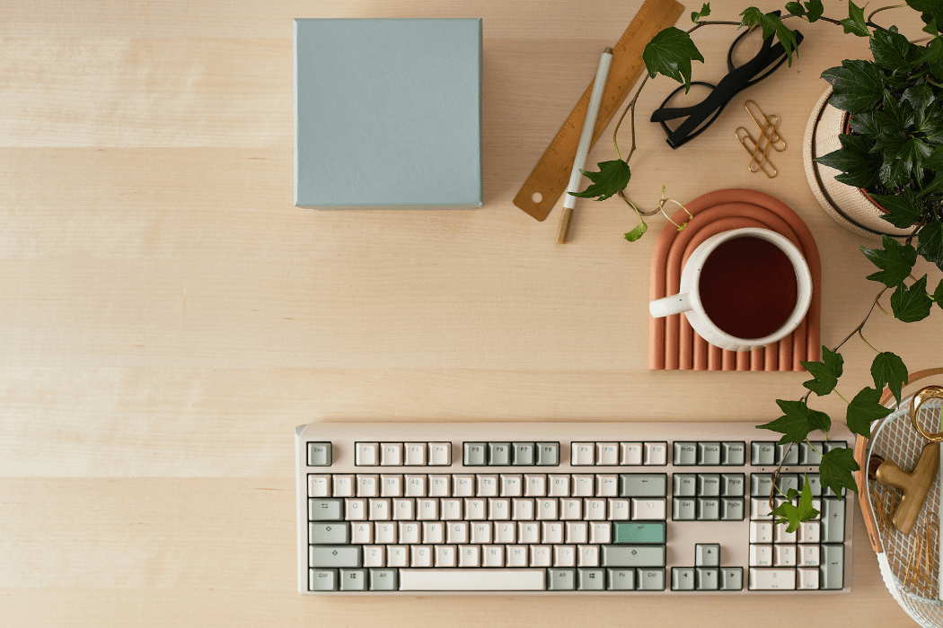 Keyboard and mug on desk