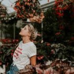 Woman with eyes closed looking up to feel calm