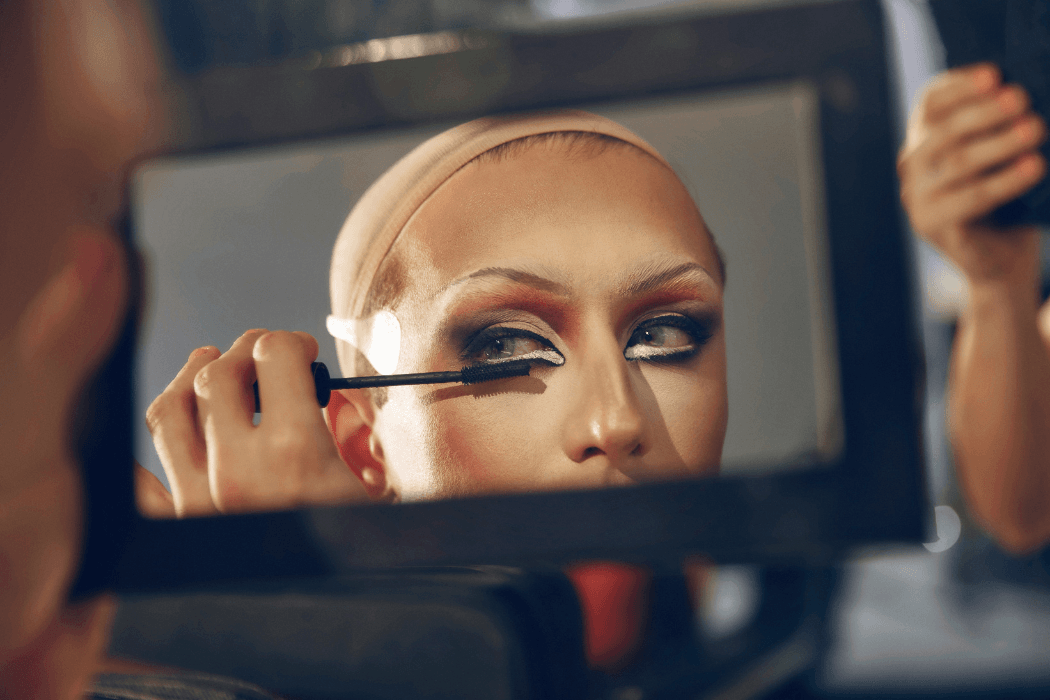 Drag queen applying mascara